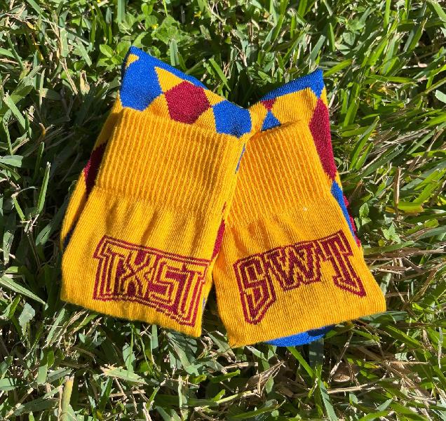 Yellow gold socks with TXST and SWT logos