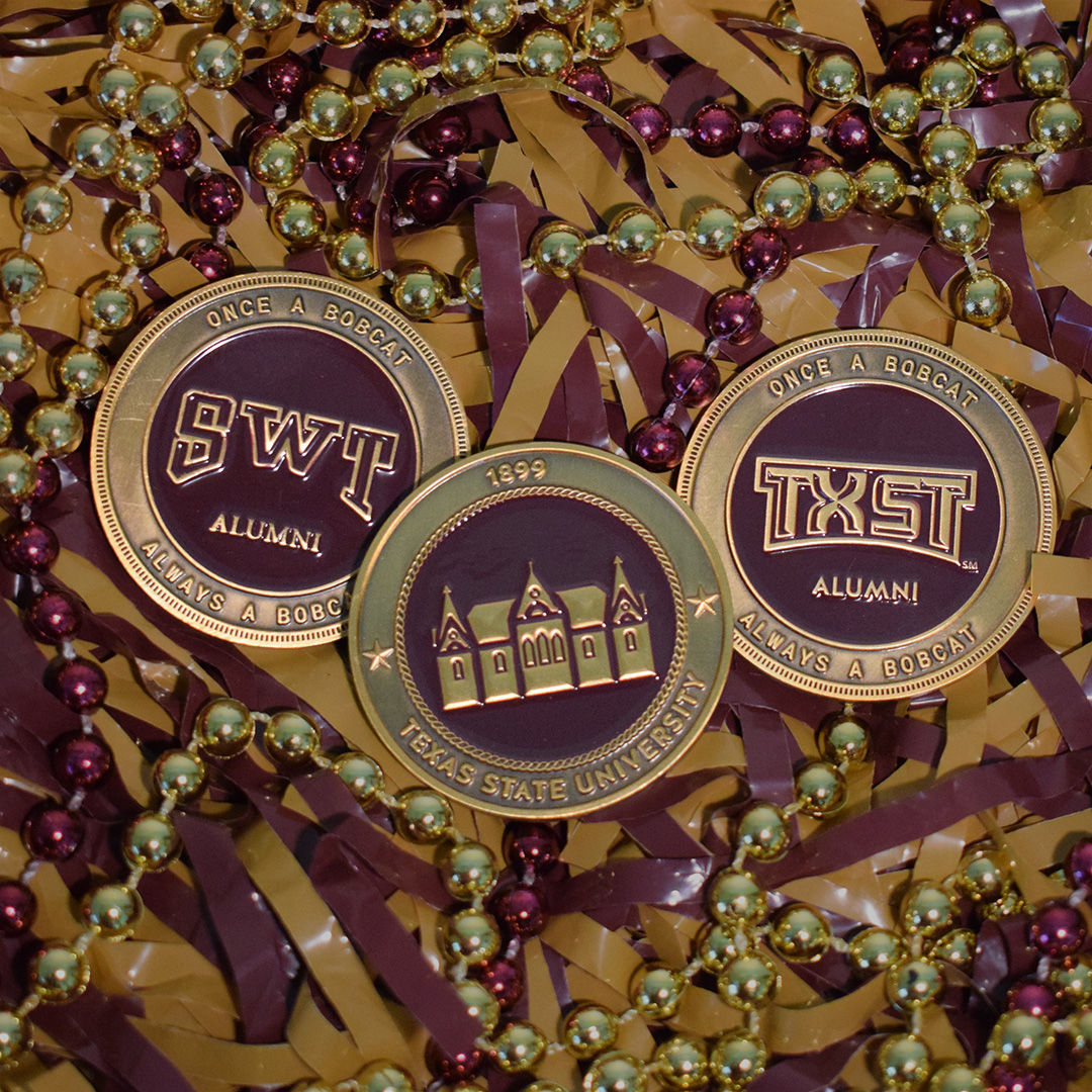 Alumni challenge coins with Old Main design and two different back designs for SWT alumni and TXST alumni