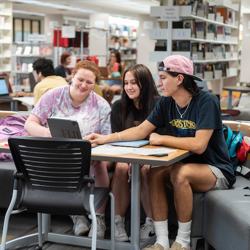 Three students at a computer