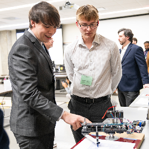 Engineering students looking at project