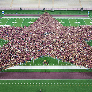 2025 fall freshman class on the football field in the shape of a star