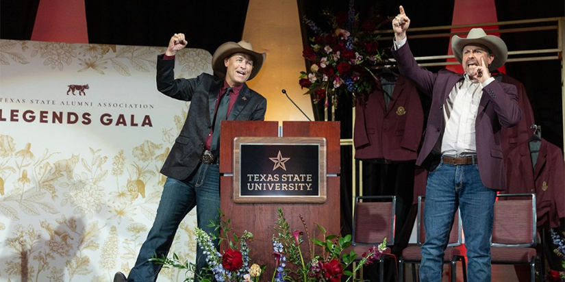 Kelly Damphousse and Larry Gaddes on stage at the Texas State Legends Gala