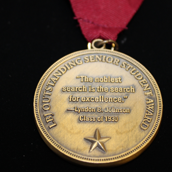 Medal with text reading 